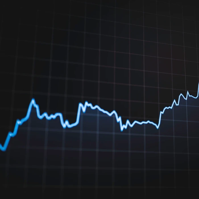 A blue fluctuating line chart on a black background